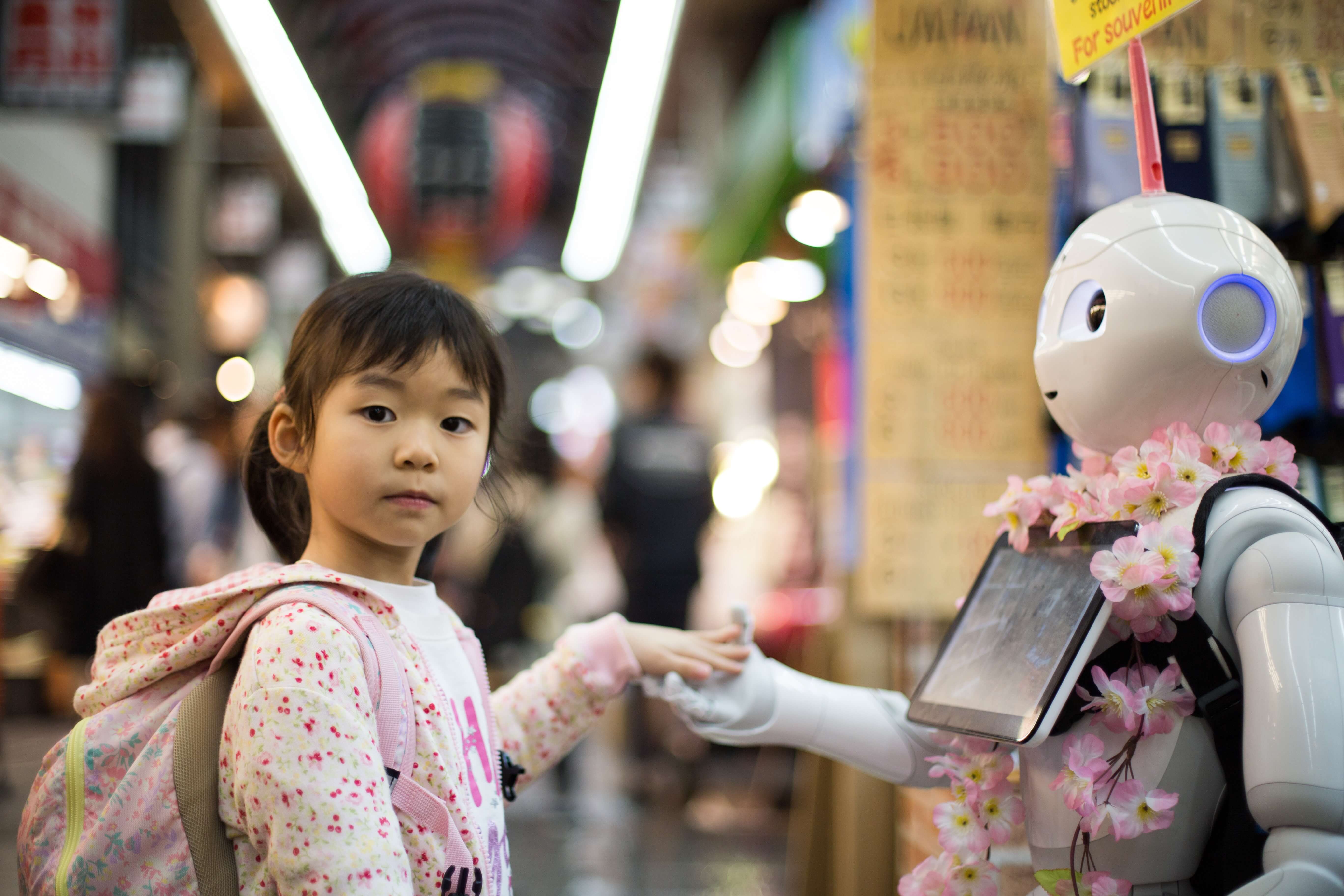 Asian child with robot